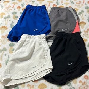 Lot of 4 women’s medium Nike dri-fit shorts solid running sports activewear